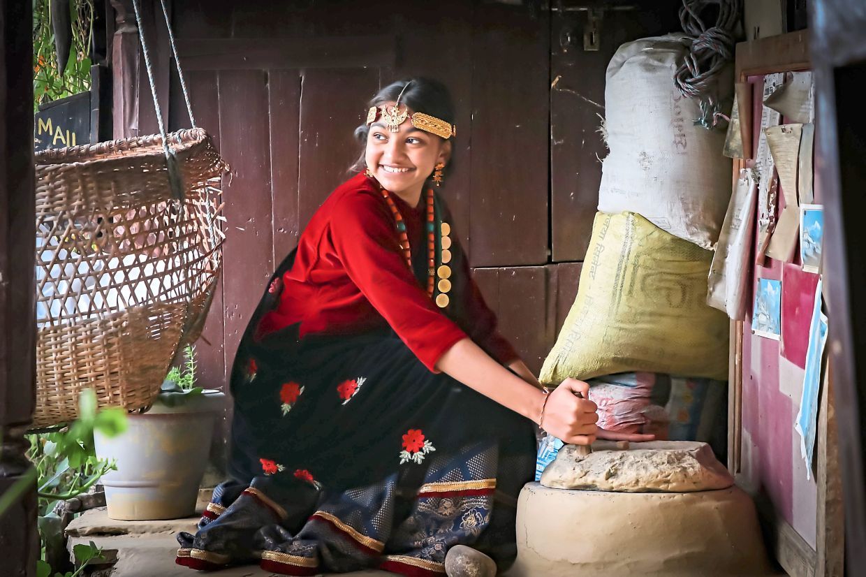 In Nepal, Kalirra got to try on a traditional Gurung costume. — TIJEN MAHARJAN
